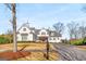 Two-story home with white siding, gray shutters, and a brick walkway at 415 Burbury Close, Fayetteville, GA 30215