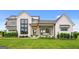 Stunning two-story farmhouse with white exterior, stone accents, and a covered porch at 0 Matteo Way # 16, Fayetteville, GA 30215