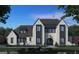 Two-story home with brick exterior, metal roof, and landscaping at 0 Matteo Way # 20, Fayetteville, GA 30215