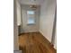 Bright dining room with hardwood floors and a window with blinds at 845 Metropolitan Sw Pkwy, Atlanta, GA 30310