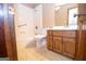 Clean bathroom with shower/tub combo and wood vanity at 215 Creekside Trl, Fayetteville, GA 30214