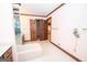 Bathroom with bathtub, double vanity, and walk-in closet at 215 Creekside Trl, Fayetteville, GA 30214