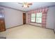 Well-lit bedroom with ceiling fan and window coverings at 215 Creekside Trl, Fayetteville, GA 30214