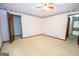 Spacious bedroom with ample natural light and ceiling fan at 215 Creekside Trl, Fayetteville, GA 30214