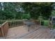 Wooden deck with table and chairs, overlooking backyard at 215 Creekside Trl, Fayetteville, GA 30214