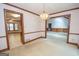 Bright dining room with chandelier and access to kitchen and living room at 215 Creekside Trl, Fayetteville, GA 30214