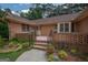Front entrance of a brick house with a walkway and landscaping at 215 Creekside Trl, Fayetteville, GA 30214