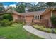 Brick house entrance with steps leading to a covered porch at 215 Creekside Trl, Fayetteville, GA 30214