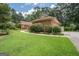 House exterior showcasing side yard, landscaping, and driveway at 215 Creekside Trl, Fayetteville, GA 30214