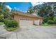 Attached brick garage with a large driveway at 215 Creekside Trl, Fayetteville, GA 30214