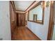 Long hallway with wood flooring and built-in storage at 215 Creekside Trl, Fayetteville, GA 30214