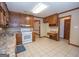 Kitchen with wood cabinets and granite countertops at 215 Creekside Trl, Fayetteville, GA 30214