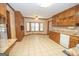 Kitchen with wood cabinets, granite countertops, and tiled floor at 215 Creekside Trl, Fayetteville, GA 30214