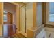 Bright bathroom with a walk-in shower and access to another room at 12178 Brown Bridge Rd, Covington, GA 30016