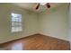 Spacious bedroom with hardwood floors and a ceiling fan at 12178 Brown Bridge Rd, Covington, GA 30016