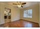 Bright dining room with hardwood floors and kitchen views at 12178 Brown Bridge Rd, Covington, GA 30016