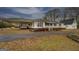 Charming single story home with large carport, landscaped front yard, and white siding at 12178 Brown Bridge Rd, Covington, GA 30016