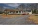 Cozy single story home with carport, bay window, and landscaped front yard at 12178 Brown Bridge Rd, Covington, GA 30016