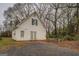 White workshop building with double doors and gravel parking at 12178 Brown Bridge Rd, Covington, GA 30016