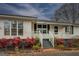 Inviting front porch with white railings and colorful flower beds at 12178 Brown Bridge Rd, Covington, GA 30016