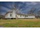 White house exterior with a large backyard at 12178 Brown Bridge Rd, Covington, GA 30016