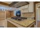 Kitchen detail showing granite countertops and a gas cooktop at 12178 Brown Bridge Rd, Covington, GA 30016