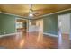 Open living area with hardwood floors and views into other rooms at 12178 Brown Bridge Rd, Covington, GA 30016