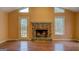 Living room featuring a stone fireplace and hardwood floors at 12178 Brown Bridge Rd, Covington, GA 30016