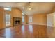 Spacious living room with hardwood floors, a stone fireplace and vaulted ceiling at 12178 Brown Bridge Rd, Covington, GA 30016