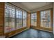 Bright sunroom with wood paneling and large windows at 12178 Brown Bridge Rd, Covington, GA 30016