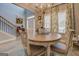 Elegant dining area with a round table, comfortable chairs, and large windows for natural light at 4128 Pemberton Dr, Covington, GA 30014