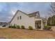 Side view of home, showcasing its siding, windows, and outdoor seating area at 4128 Pemberton Dr, Covington, GA 30014