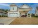 Beautiful home with a covered patio, two-car garage, and well-maintained lawn at 4128 Pemberton Dr, Covington, GA 30014