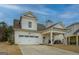 Lovely two-story home with a spacious garage, covered patio, and well-kept yard at 4128 Pemberton Dr, Covington, GA 30014