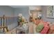 Hallway showcasing decoratively furnished area with wood banister and mirror at 4128 Pemberton Dr, Covington, GA 30014