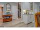 Hallway area features natural light, wood floors, cabinets and mirror at 4128 Pemberton Dr, Covington, GA 30014