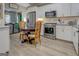 Bright kitchen with white cabinets, stainless steel appliances, and modern countertops at 4128 Pemberton Dr, Covington, GA 30014