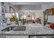 Open concept living room visible from the kitchen, with a cozy fireplace and neutral decor at 4128 Pemberton Dr, Covington, GA 30014