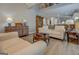Open-concept living room featuring hardwood floors, comfortable seating, and a view into the kitchen at 4128 Pemberton Dr, Covington, GA 30014