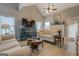 Cozy living room features vaulted ceilings, a fireplace, and hardwood floors, providing a welcoming atmosphere at 4128 Pemberton Dr, Covington, GA 30014