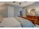 Spacious main bedroom featuring neutral paint, and dark wood furniture at 4128 Pemberton Dr, Covington, GA 30014