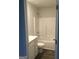 Bathroom features a bathtub, toilet, and vanity with cabinets at 9168 Carr Cir, Covington, GA 30014