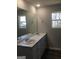 Double vanity bathroom with updated fixtures and flooring at 9168 Carr Cir, Covington, GA 30014