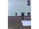 Rear view of the house showing brick and a door to the interior at 9168 Carr Cir, Covington, GA 30014