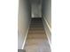 Carpeted staircase leading to the second floor at 9168 Carr Cir, Covington, GA 30014