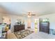 Large bedroom with ceiling fan and view to attached bathroom at 4051 Rotterdam Pass, Hampton, GA 30228