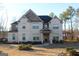 Two-story brick house with a covered entryway and landscaped lawn at 4051 Rotterdam Pass, Hampton, GA 30228