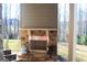 Outdoor brick fireplace with a stainless steel firebox at 4051 Rotterdam Pass, Hampton, GA 30228