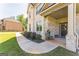Inviting front porch with brick details, a decorative door, and manicured landscaping at 4051 Rotterdam Pass, Hampton, GA 30228
