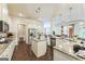 Bright kitchen featuring stainless steel appliances, granite countertops, and pendant lighting at 4051 Rotterdam Pass, Hampton, GA 30228
